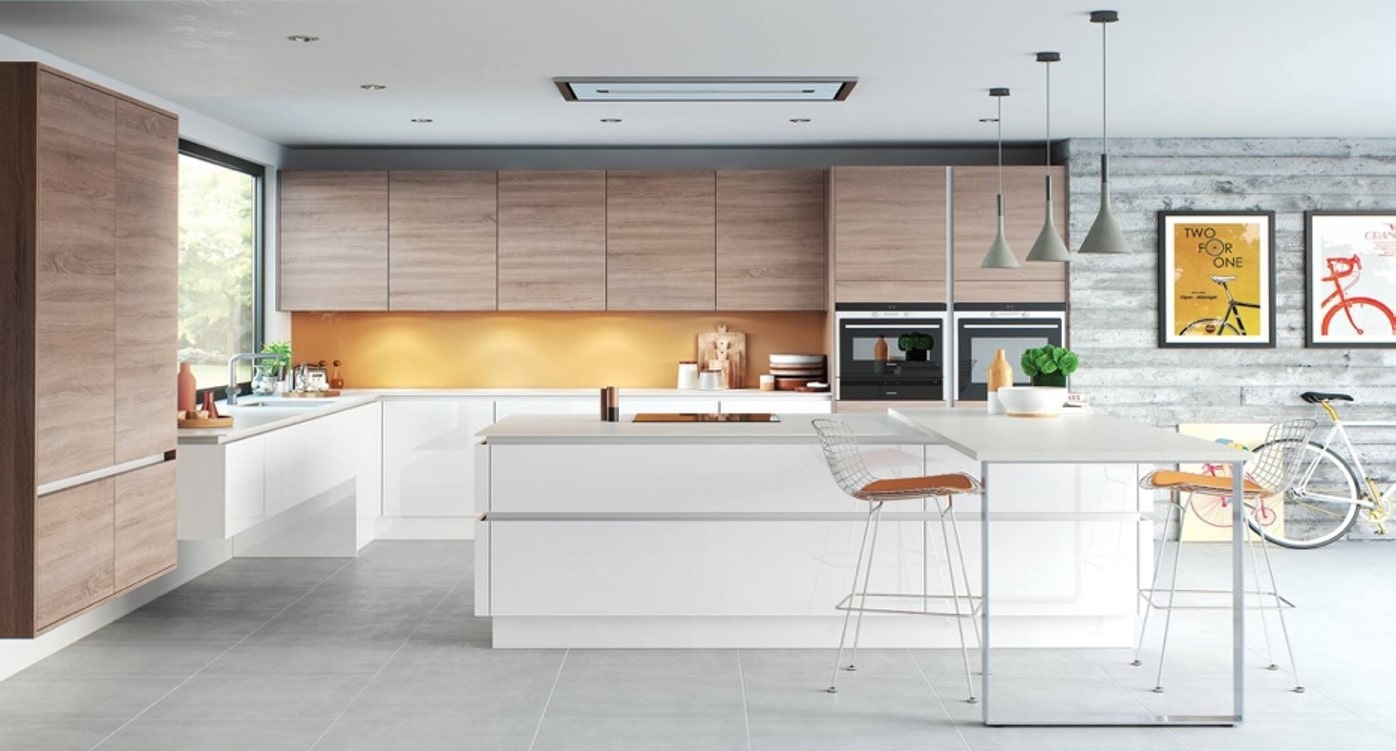 A modern kitchen with white counter tops and light wood grain cupboards